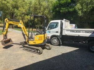Small digger and truck Tim Hood contracting